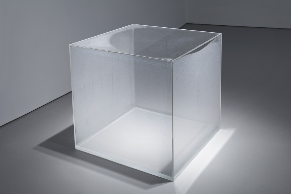 Clear cube with condensation forming on the inside