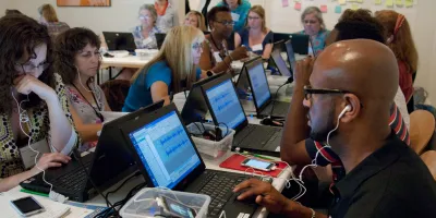 teachers working on computers