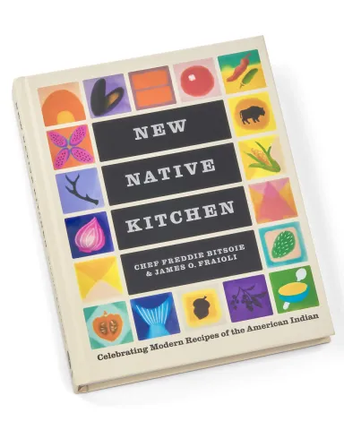 A cookbook with colorful tiles around the border.