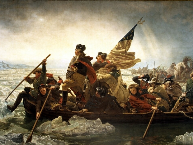 Painting of Washington crossing the Delaware as he holds an American flag.