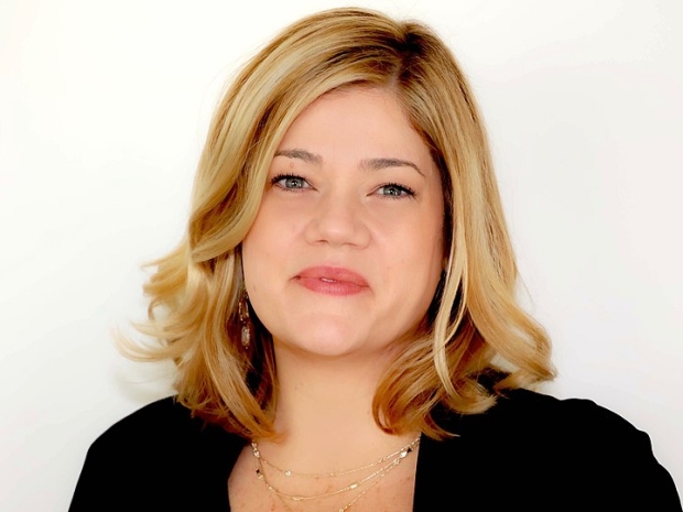 Headshot of Nicole Angarella against white background