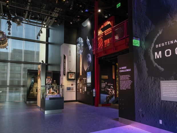 Entrance to Destination Moon exhibit with wall text and small artifacts