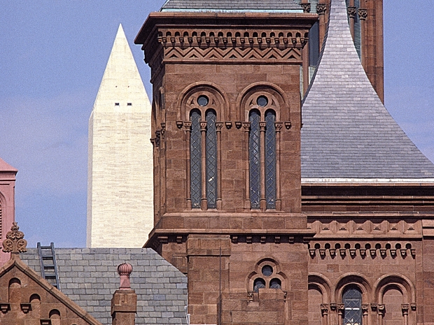 Castle towers with monument in the background