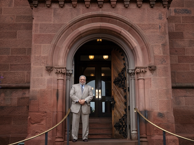 Lonnie Bunch stands at east door of Castle