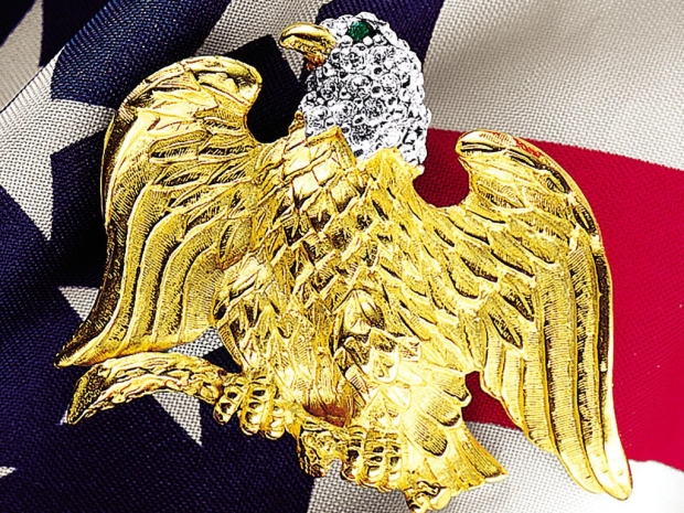 Gold eagle pin with diamond detail