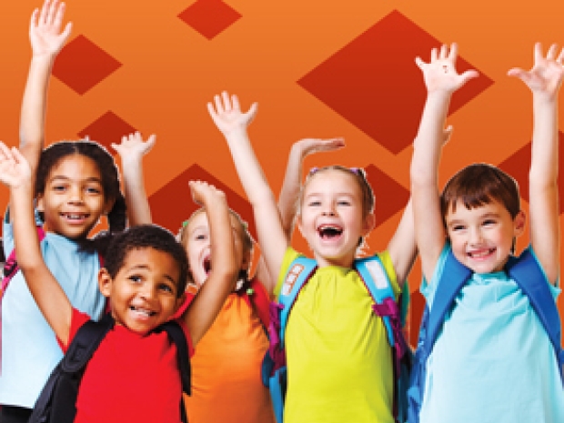 A group of young students cheer in excitement.