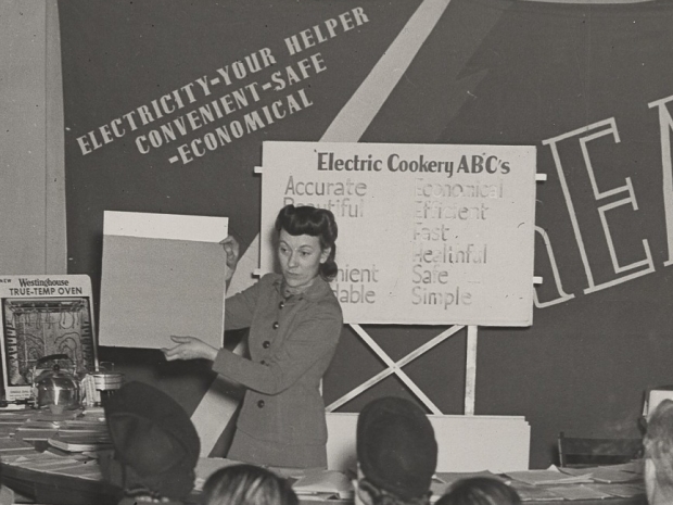 woman teaching about cooking with electricity