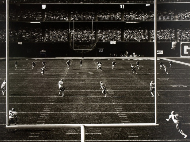 view of a football field through the goal posts