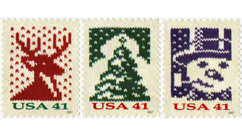 Three stamps with designs featuring a stag, tree and snowman
