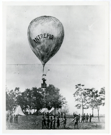 Black and white photo of a balloon ascending