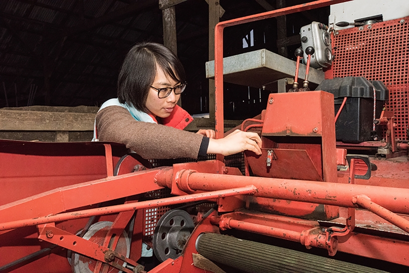 Woman examines equipment
