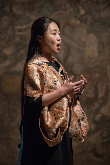 Woman in traditional clothing singing