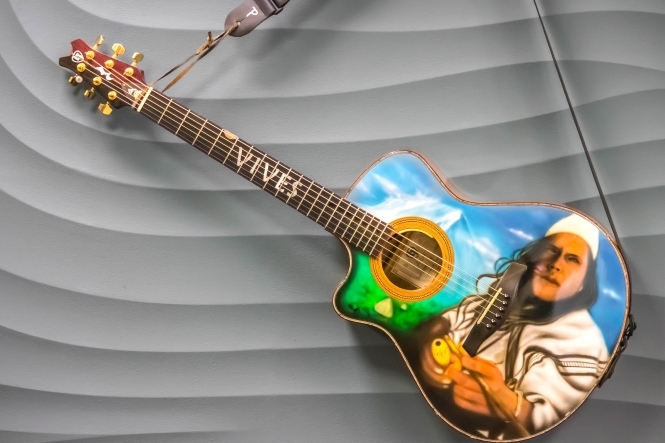 Guitar with airbrushed portrait of Carlos Vives