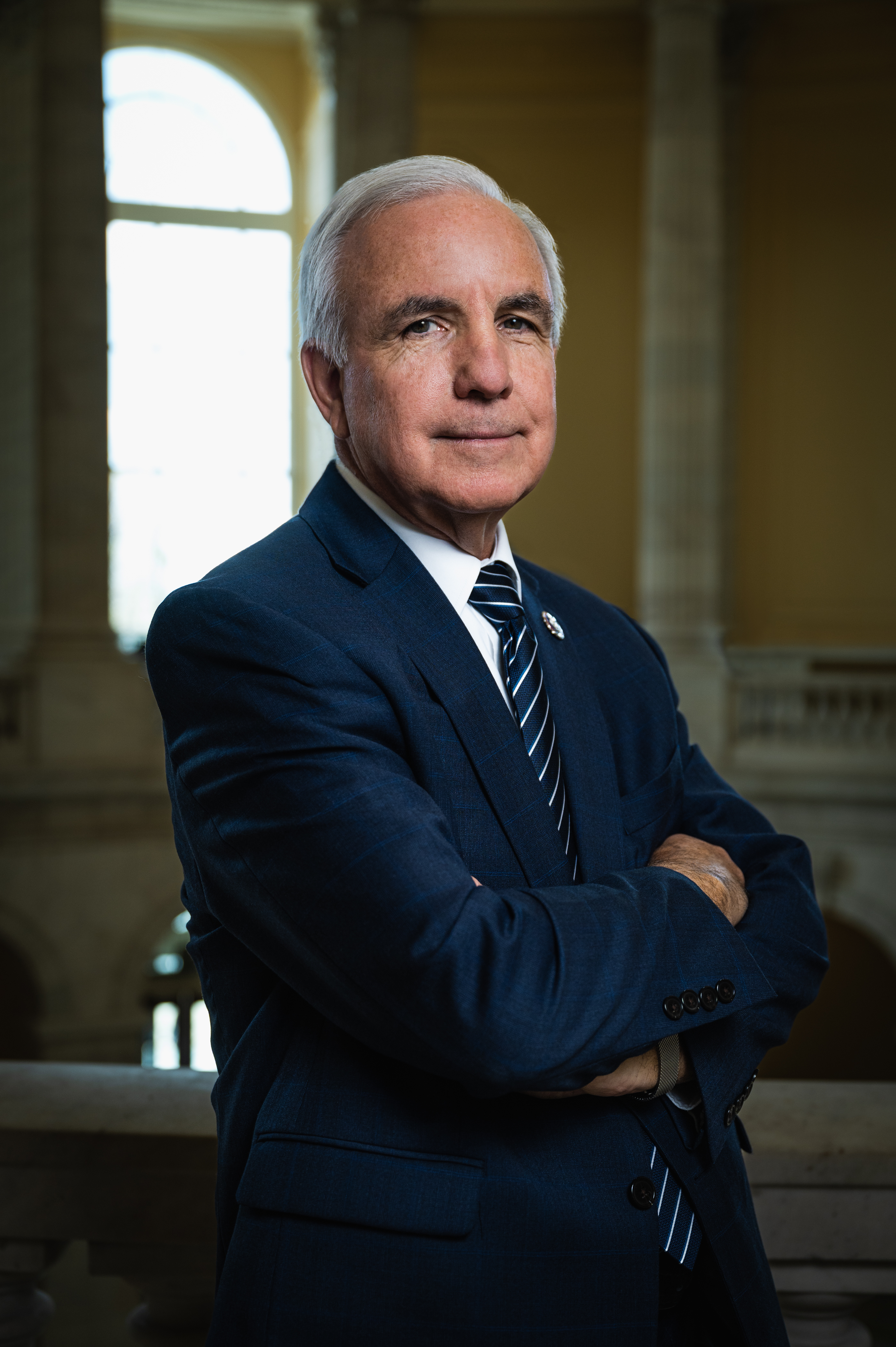 Photo of Representative Carlos Gimenez, a man wearing a suit standing in the U.S. Capitol Building.
